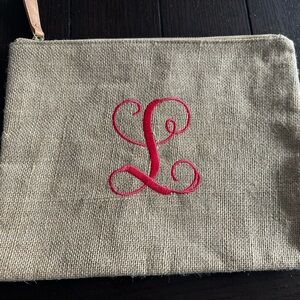 Stylish Tan Clutch with Pink “L” Monogram